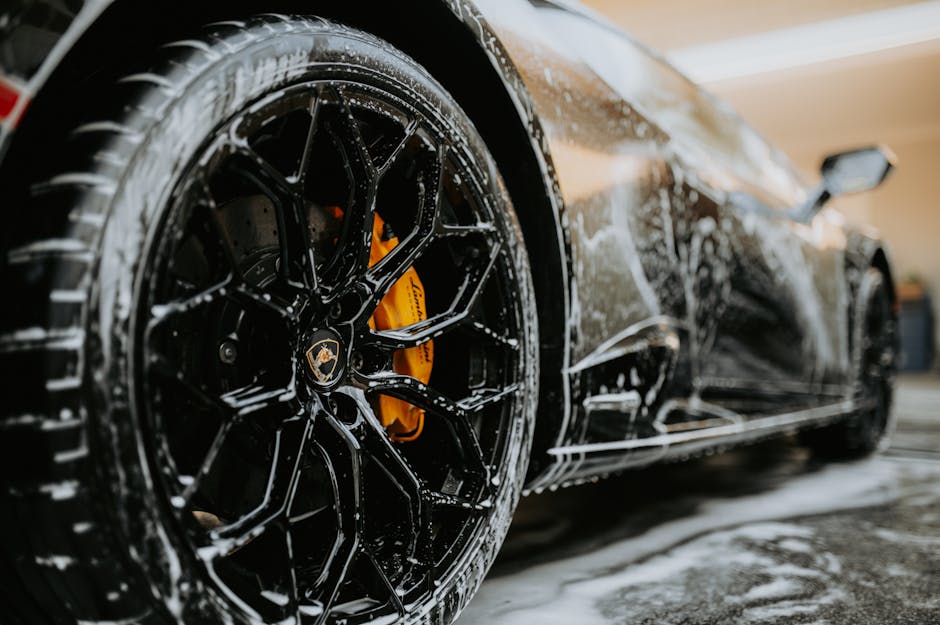 Premium car wash service detailing a luxury vehicle